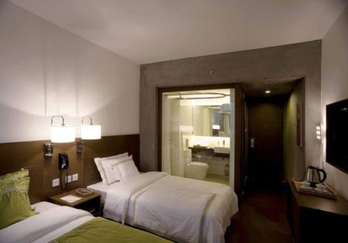 張家港新世匯酒店客房設(shè)計效果圖完美展現(xiàn)酒店改造設(shè)計的魅力